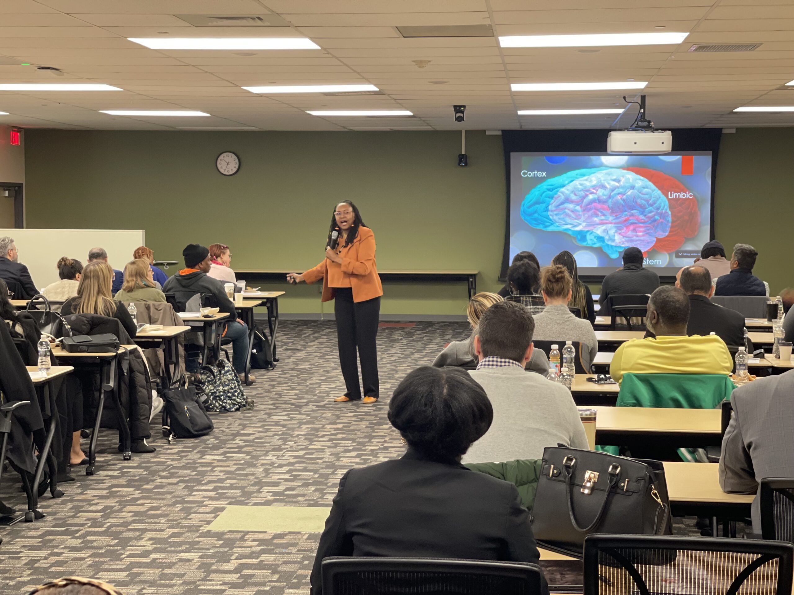 Valencia “Coach V” Peterson speaking to a room